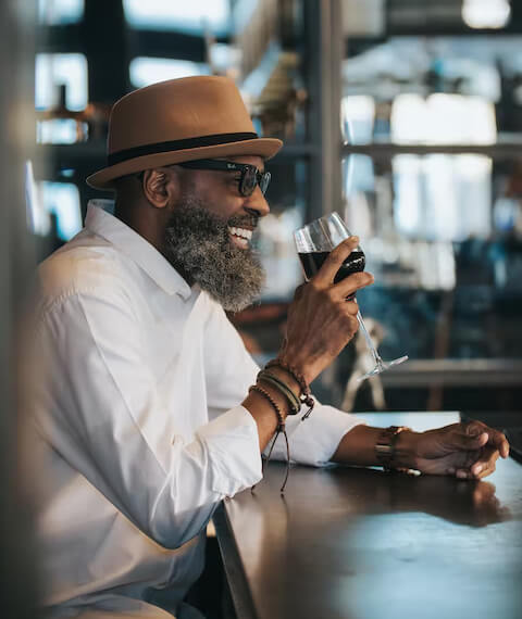 A man with a glass of wine